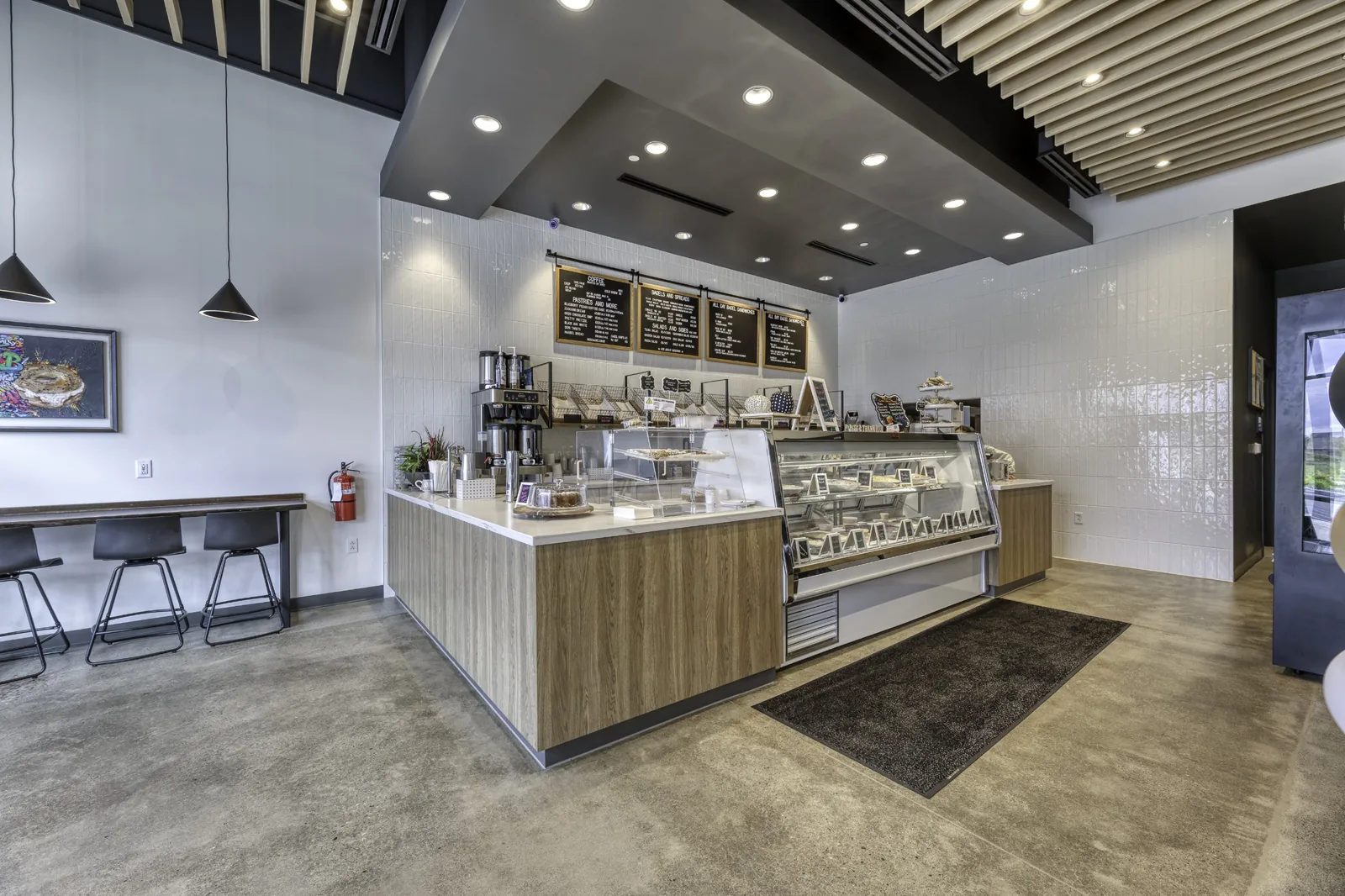 The counter and menu boards inside B's Bagels in Westfield