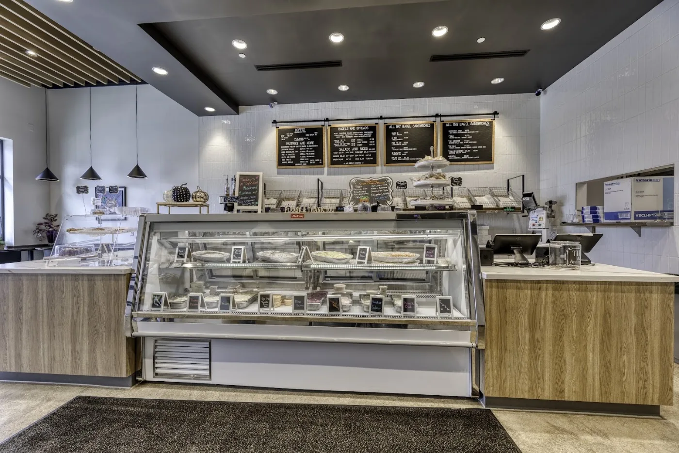 Inside B's Bagels: the counter, pastry case and seating