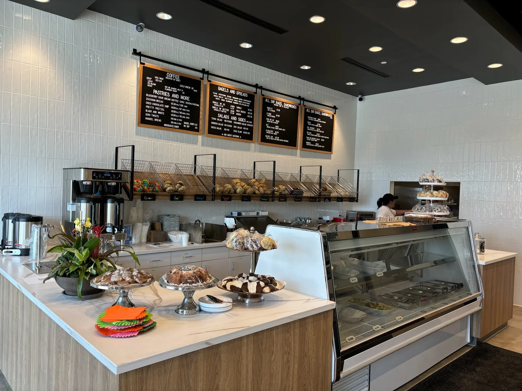 The counter and menu boards inside B's Bagels in Westfield